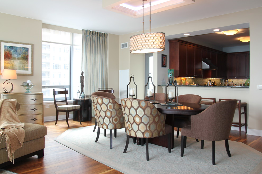 Photo of a mid-sized contemporary separate dining room in Chicago with beige walls, dark hardwood floors and brown floor.