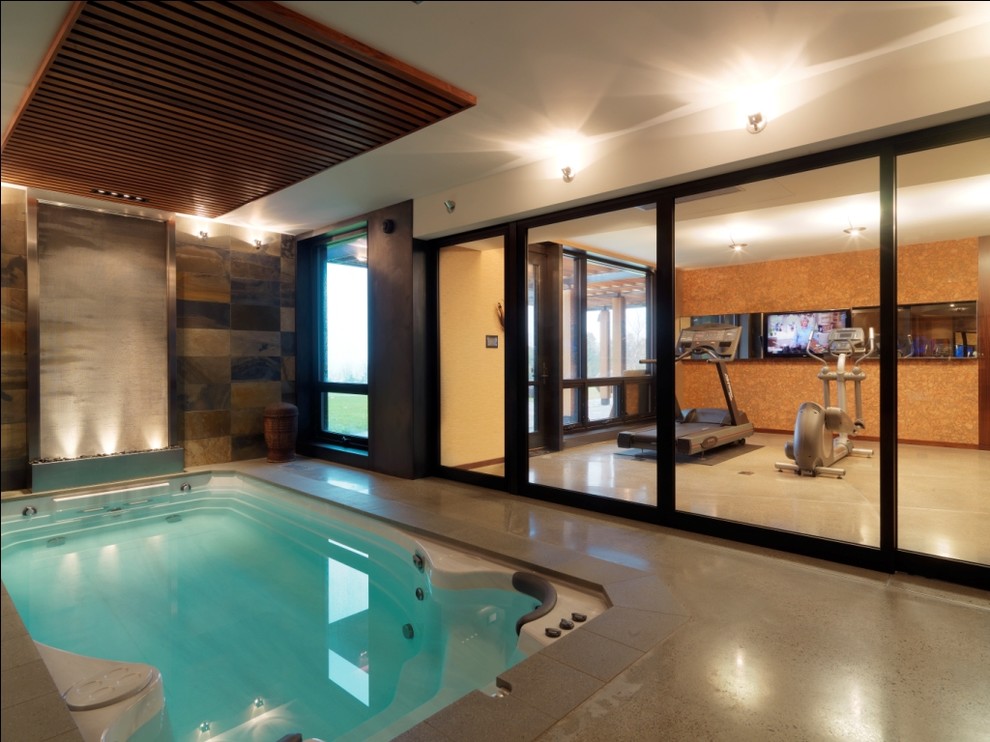 Example of a small mountain style rectangular hot tub design in Burlington