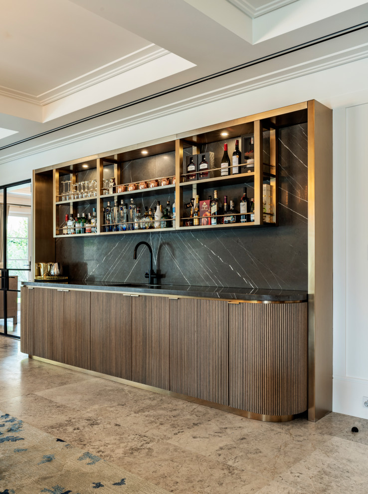 Contemporary single-wall wet bar in Sydney with an undermount sink, flat-panel cabinets, dark wood cabinets, black splashback, stone slab splashback, brown floor and black benchtop.