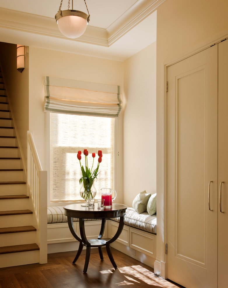 Inspiration for a traditional entryway in San Francisco with white walls, dark hardwood floors and brown floor.
