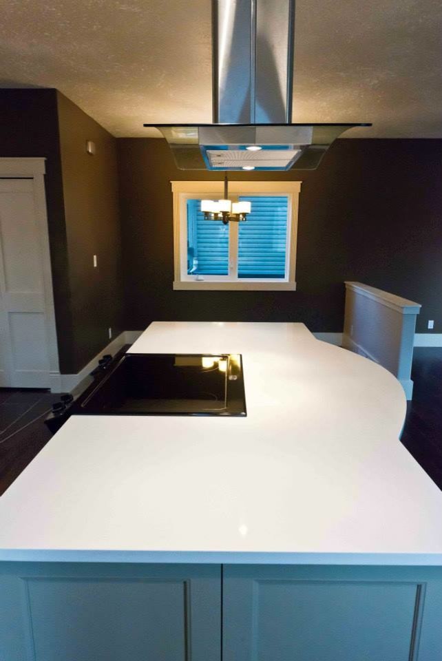 Kitchen pantry - transitional l-shaped dark wood floor kitchen pantry idea in Edmonton with an undermount sink, shaker cabinets, white cabinets, concrete countertops, multicolored backsplash, matchstick tile backsplash, stainless steel appliances and an island