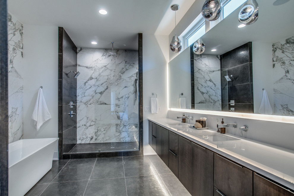 Contemporary master bathroom in Nashville with flat-panel cabinets, medium wood cabinets, a freestanding tub, an alcove shower, white walls, an undermount sink, grey floor, an open shower, white benchtops, a double vanity and a floating vanity.