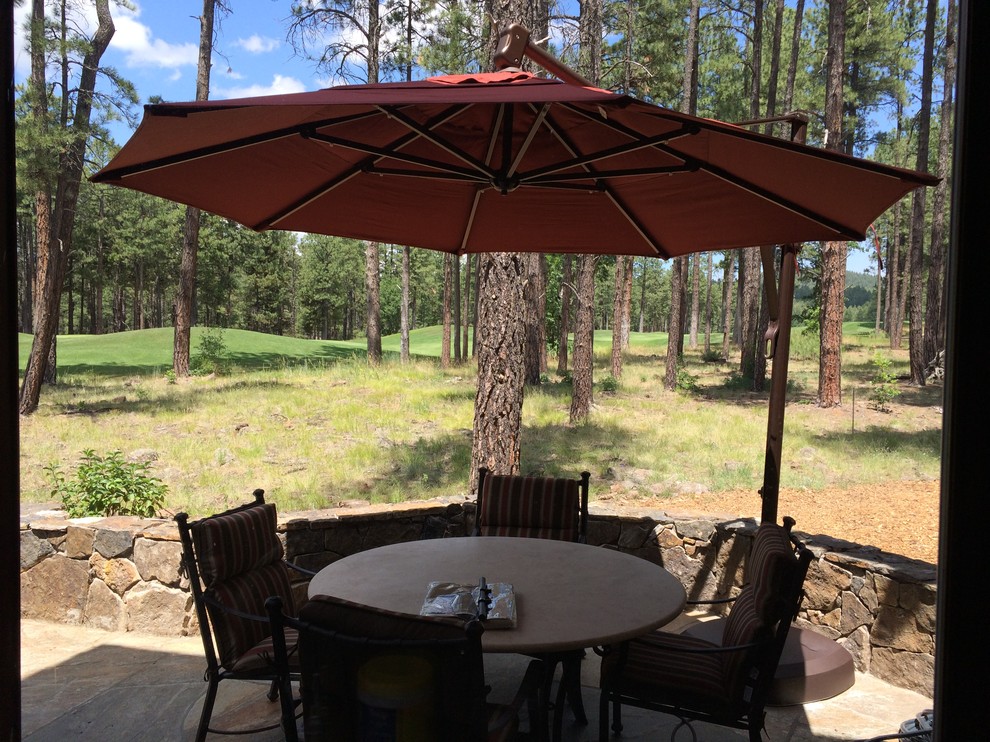 Example of a mountain style home design design in Phoenix