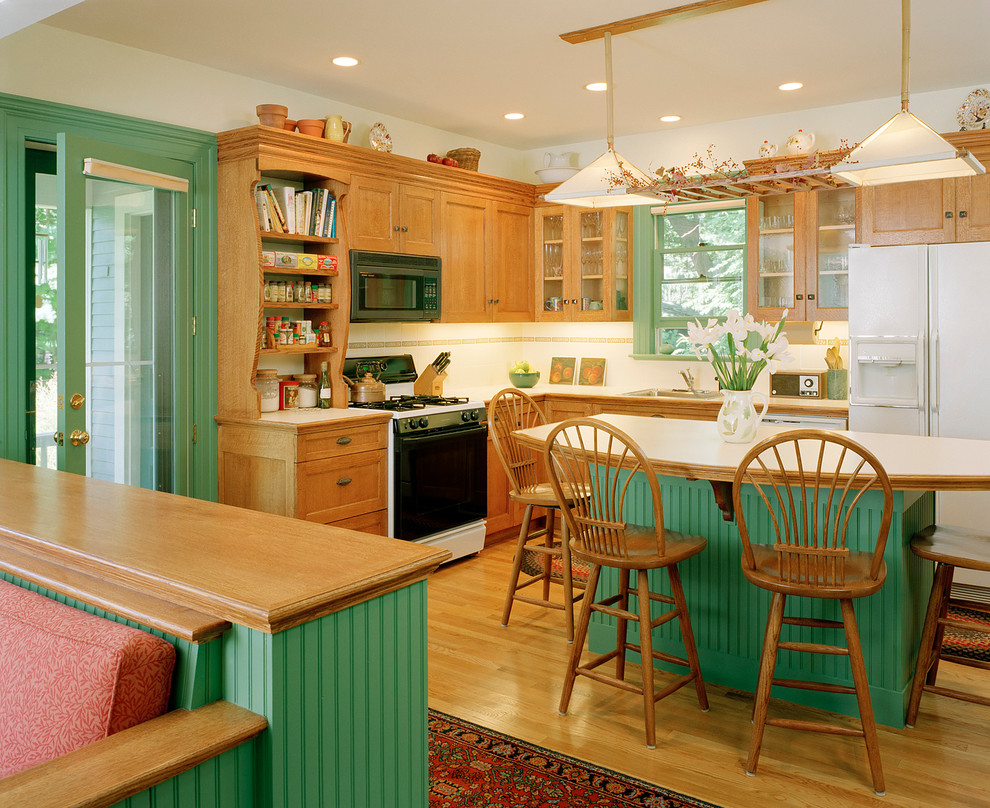 Design ideas for a traditional kitchen in Boston with white appliances and green cabinets.