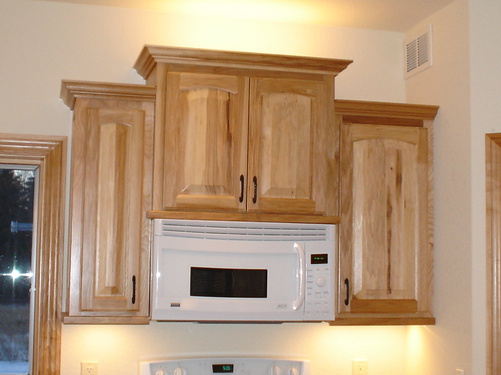 Inspiration for a kitchen remodel in Milwaukee with raised-panel cabinets and laminate countertops