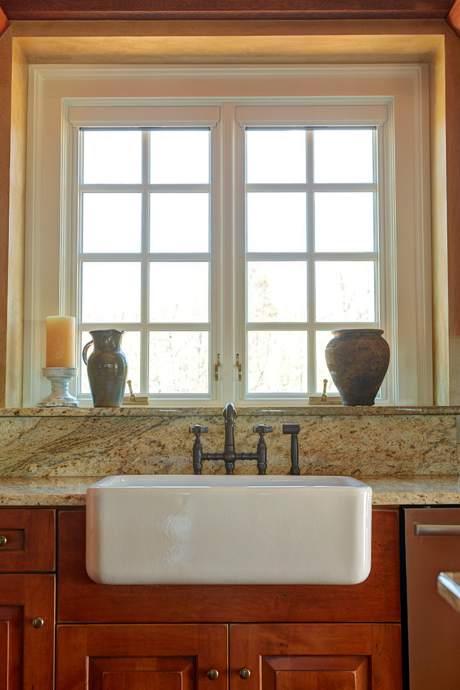 Mid-sized mountain style dark wood floor open concept kitchen photo with a farmhouse sink, raised-panel cabinets, distressed cabinets, granite countertops, multicolored backsplash, stainless steel appliances and an island
