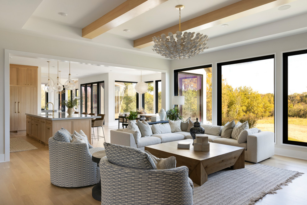 Inspiration for a huge contemporary open concept light wood floor and exposed beam living room remodel in Minneapolis