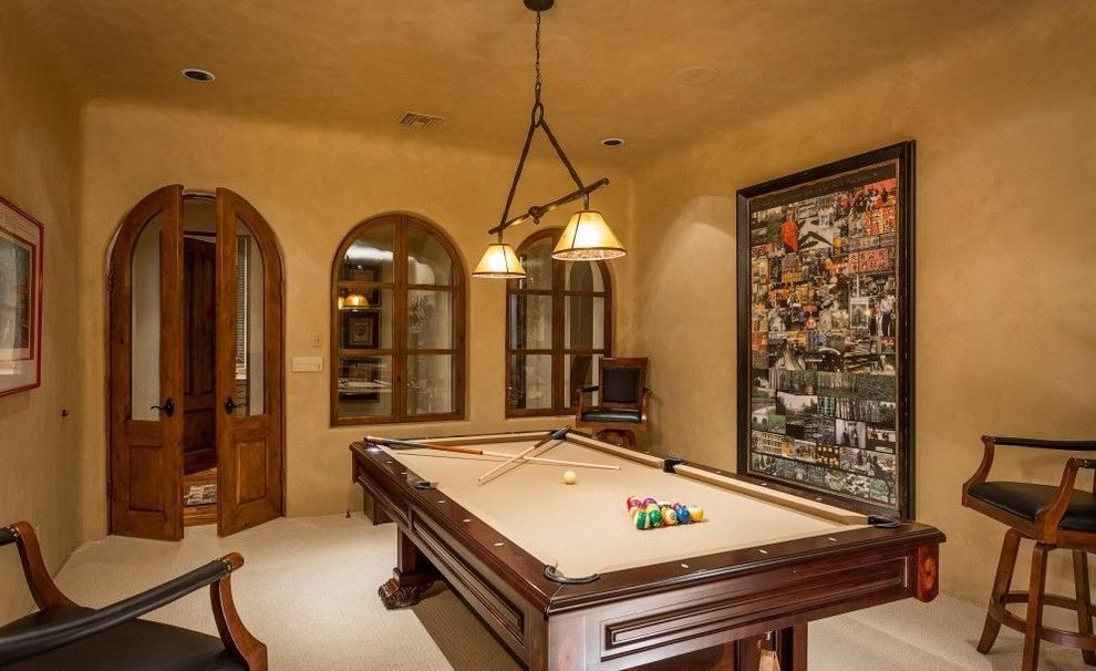 Inspiration for an expansive traditional enclosed family room in Phoenix with a game room, beige walls and carpet.
