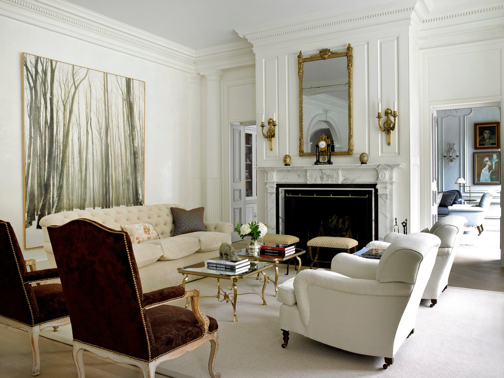 Inspiration for a traditional formal enclosed living room in New York with beige walls and a standard fireplace.