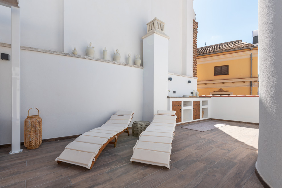 Imagen de terraza clásica renovada grande en azotea