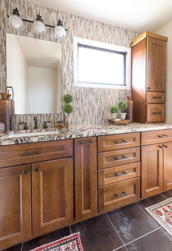 Inspiration for a small transitional master bathroom in Denver with medium wood cabinets, an alcove shower, multi-coloured tile, beige walls, granite benchtops, brown floor, multi-coloured benchtops, recessed-panel cabinets, matchstick tile, slate floors, an undermount sink and a hinged shower door.