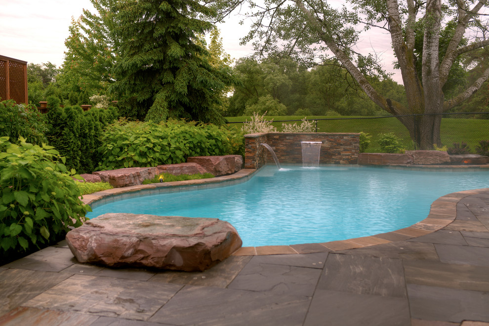 Inspiration for a large traditional pool in Toronto.