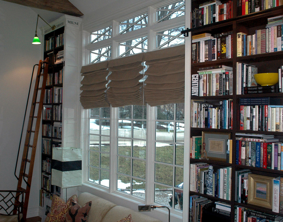 Inspiration for a victorian home office library remodel in Boston with white walls