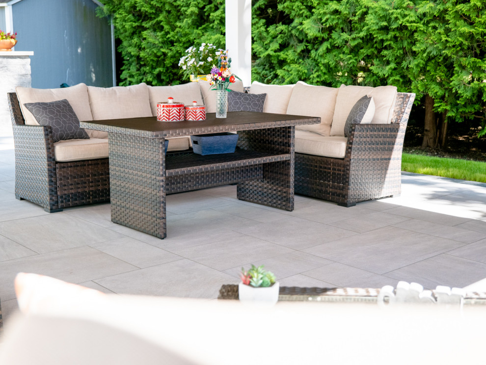 This is an example of a mid-sized contemporary backyard patio in New York with tile and a gazebo/cabana.