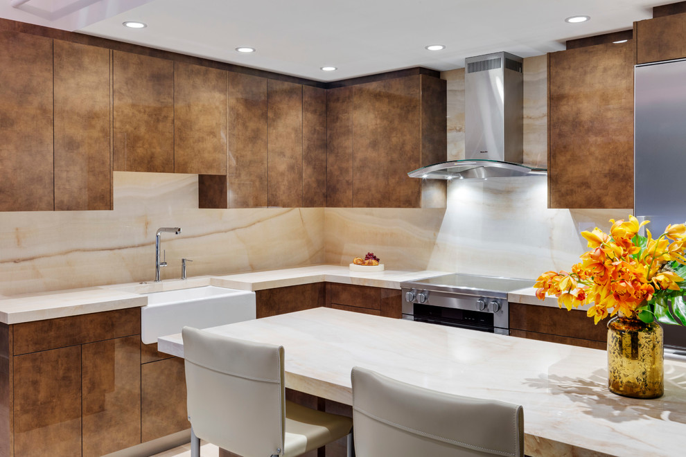 This is an example of a mid-sized contemporary l-shaped eat-in kitchen in Boston with a farmhouse sink, flat-panel cabinets, brown cabinets, onyx benchtops, multi-coloured splashback, stone slab splashback, stainless steel appliances, light hardwood floors and a peninsula.