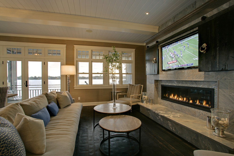 Design ideas for a traditional family room in Los Angeles with a concealed tv.