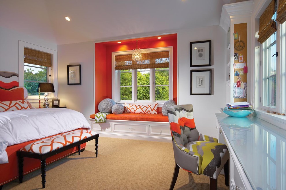 This is an example of a traditional bedroom in Orange County with orange walls and carpet.