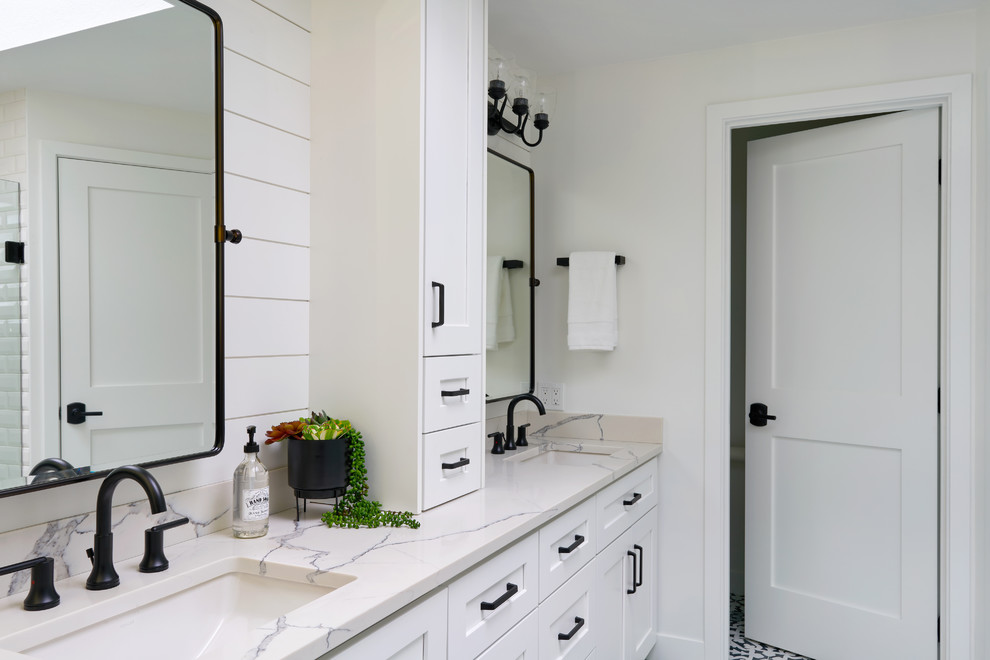Design ideas for a large master bathroom in Seattle with shaker cabinets, white cabinets, a curbless shower, white tile, white walls, cement tiles, an undermount sink, engineered quartz benchtops and a hinged shower door.