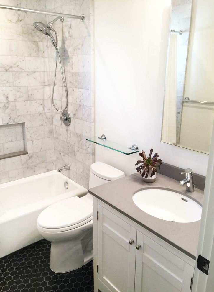 Inspiration for a small transitional kids bathroom in Santa Barbara with shaker cabinets, white cabinets, a drop-in tub, a one-piece toilet, black and white tile, porcelain tile, white walls, porcelain floors, an undermount sink and engineered quartz benchtops.