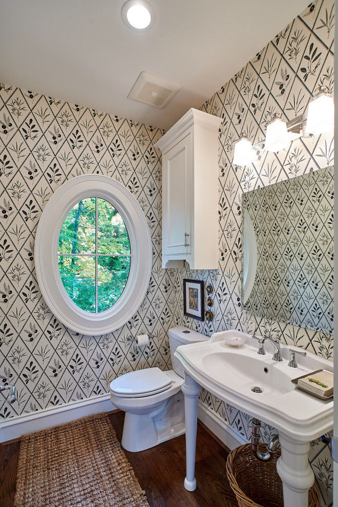 Inspiration for a traditional powder room in Cincinnati with a pedestal sink and wallpaper.