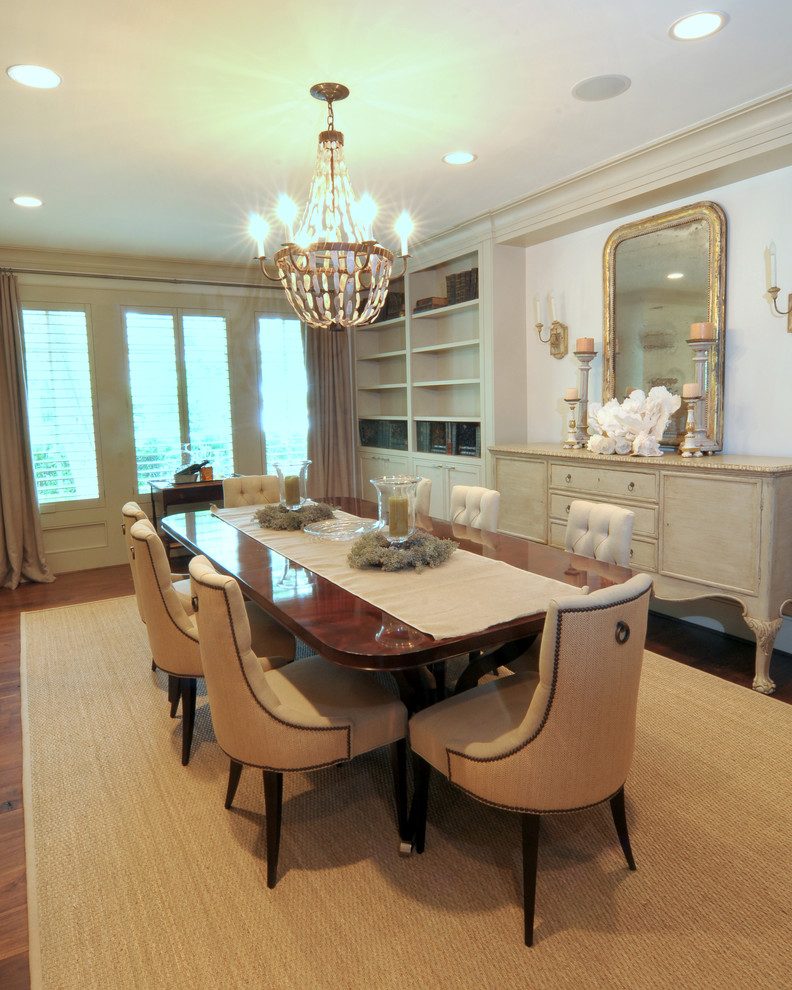 Photo of a traditional dining room in Houston with white walls and dark hardwood floors.