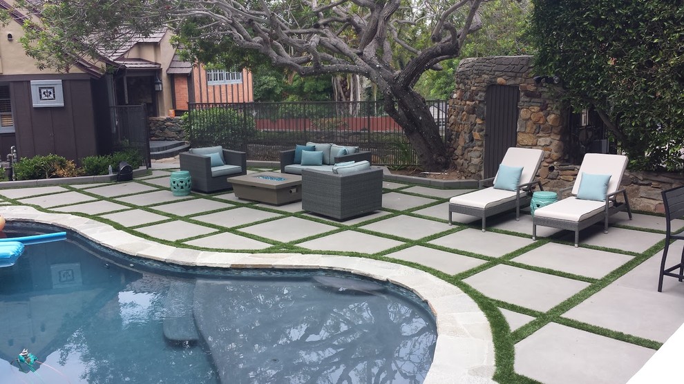 Large contemporary backyard patio in San Diego with an outdoor kitchen, concrete pavers and no cover.