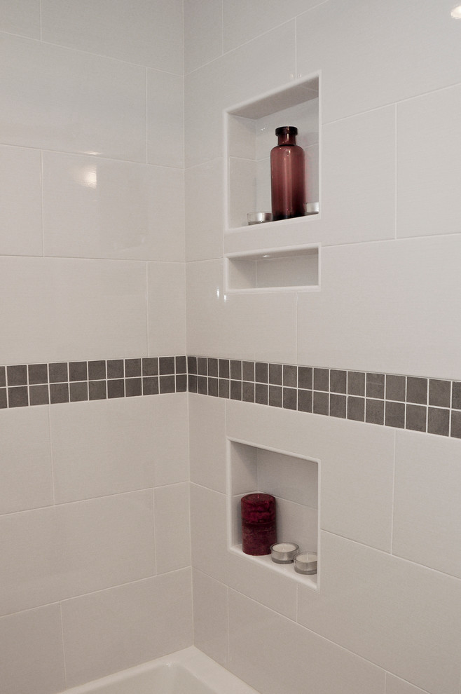 Home design - small transitional master gray tile and porcelain tile porcelain tile home design idea in Ottawa with shaker cabinets, white cabinets, a two-piece toilet, gray walls, an integrated sink and solid surface countertops