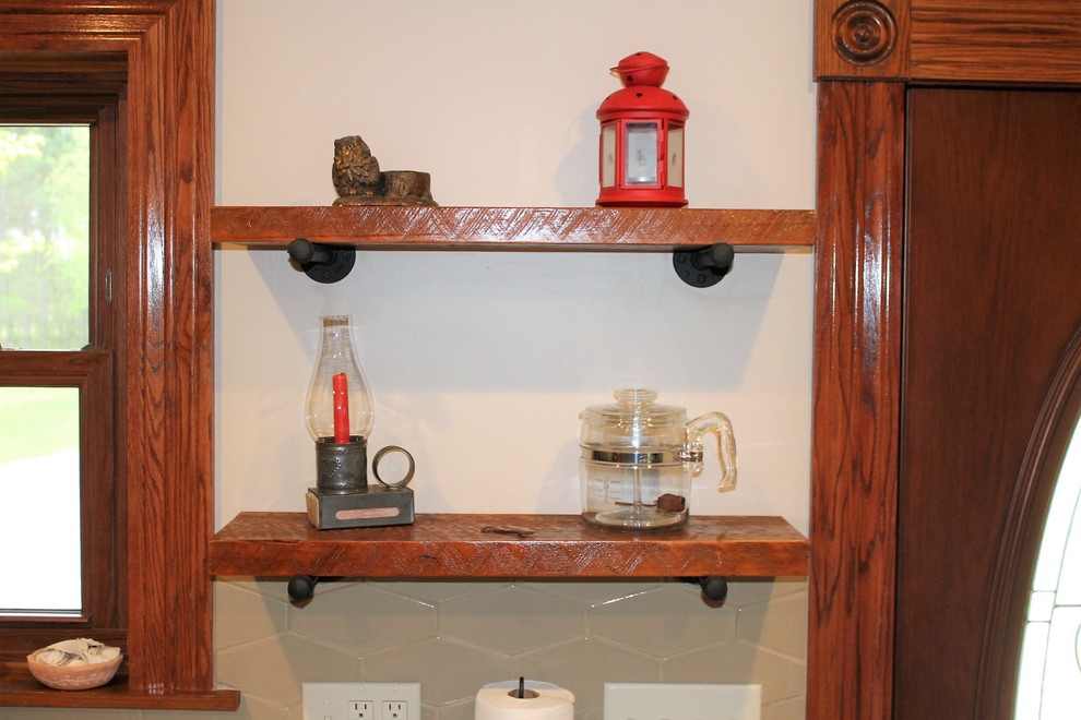 Inspiration for a mid-sized rustic l-shaped vinyl floor and beige floor eat-in kitchen remodel with a farmhouse sink, raised-panel cabinets, medium tone wood cabinets, laminate countertops, beige backsplash, cement tile backsplash, stainless steel appliances, a peninsula and beige countertops