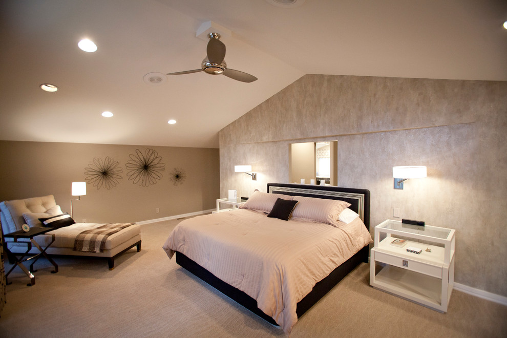 This is an example of a large contemporary master bedroom in Cincinnati with beige walls, carpet, no fireplace and beige floor.