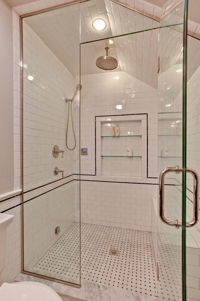 Design ideas for a mid-sized traditional master bathroom in Chicago with raised-panel cabinets, dark wood cabinets, an alcove shower, a one-piece toilet, white tile, subway tile, beige walls, mosaic tile floors, an undermount sink and marble benchtops.