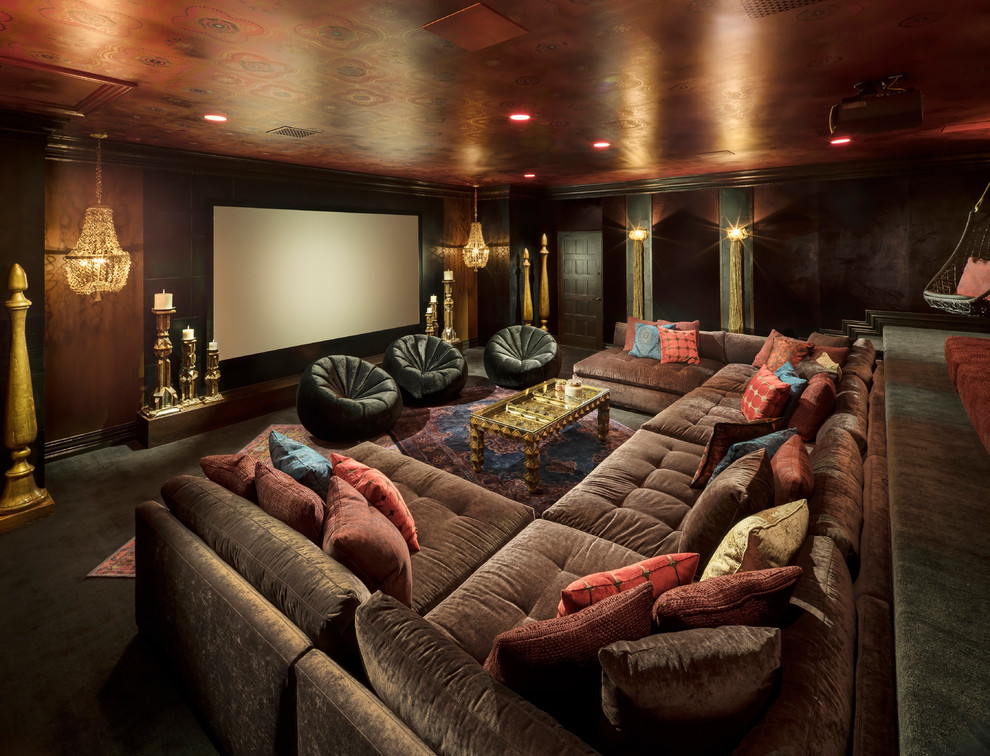 Large asian open concept home theatre in Phoenix with red walls, carpet, a projector screen and grey floor.
