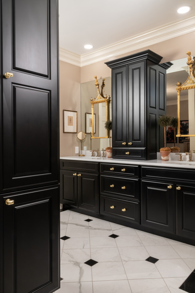 This is an example of an expansive eclectic master bathroom in St Louis with raised-panel cabinets, black cabinets, a freestanding tub, a corner shower, white tile, marble, brown walls, marble floors, engineered quartz benchtops, white floor, a hinged shower door, white benchtops, a double vanity and a built-in vanity.