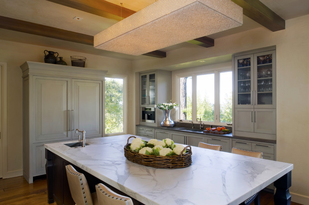 Inspiration for a transitional kitchen in San Francisco with glass-front cabinets.