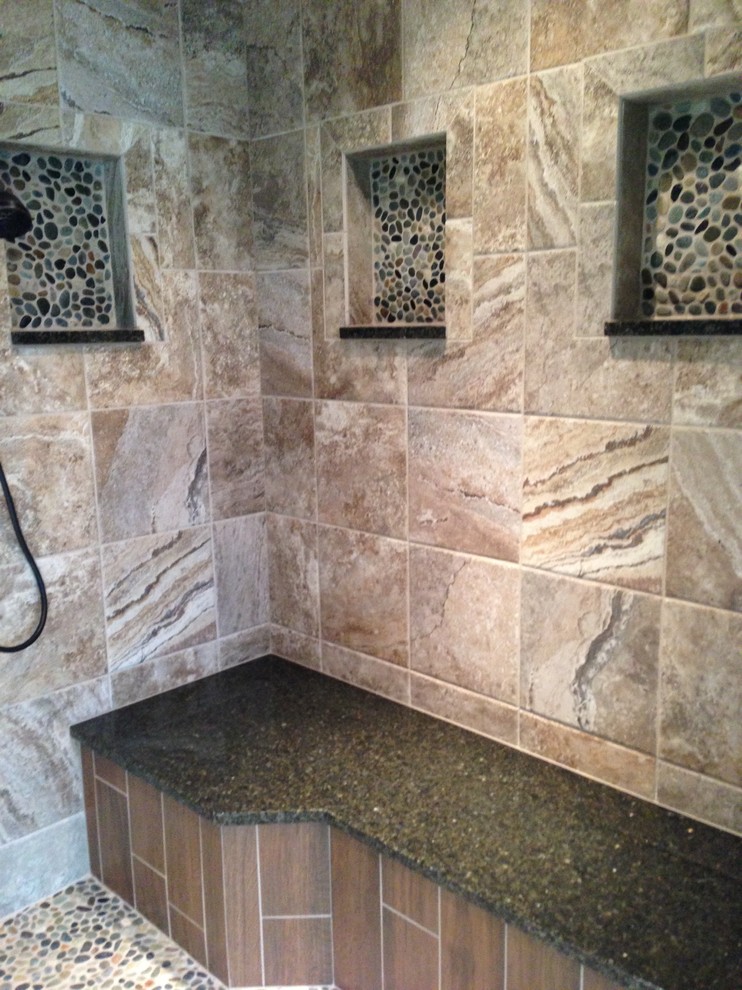 Inspiration for a large traditional master bathroom in Indianapolis with granite benchtops, a drop-in tub, a corner shower, beige tile, ceramic tile, beige walls and ceramic floors.