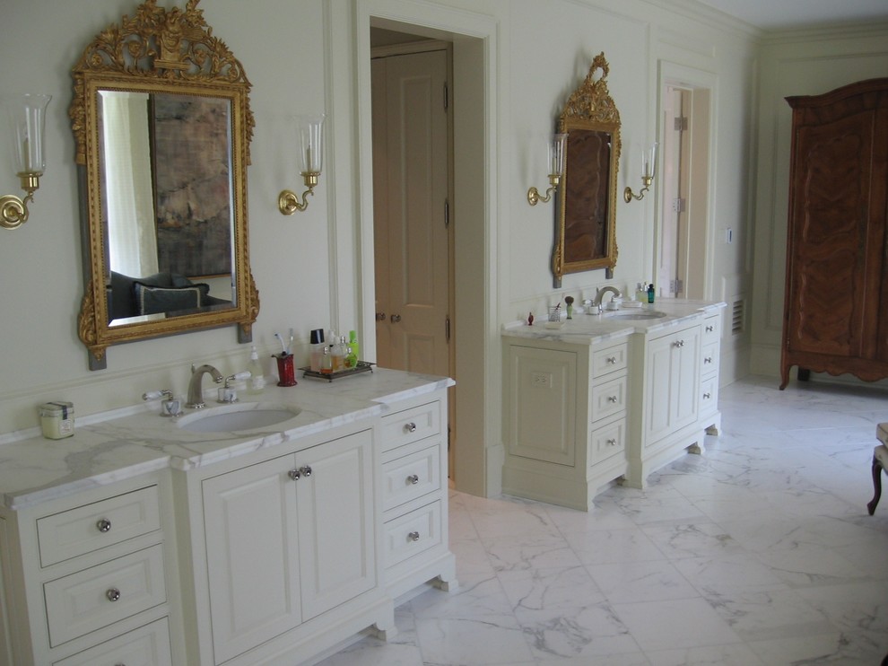 This is an example of a large traditional master bathroom in Other with white cabinets, raised-panel cabinets, white walls, marble floors, an undermount sink, marble benchtops and white floor.