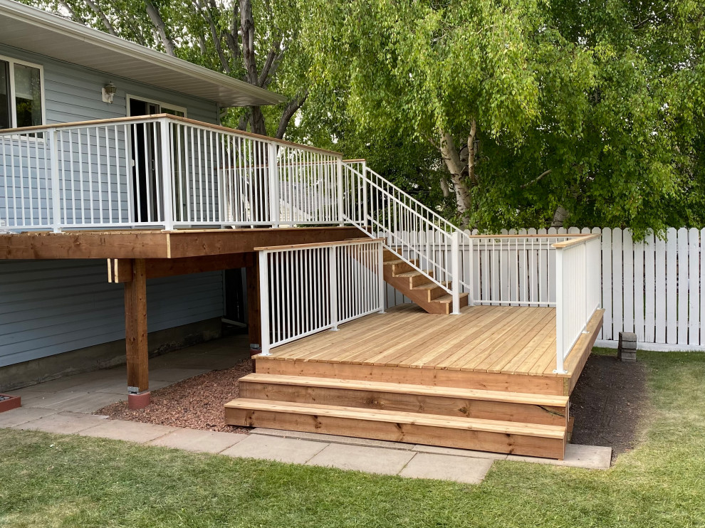 Arts and crafts backyard and first floor deck in Other with metal railing.