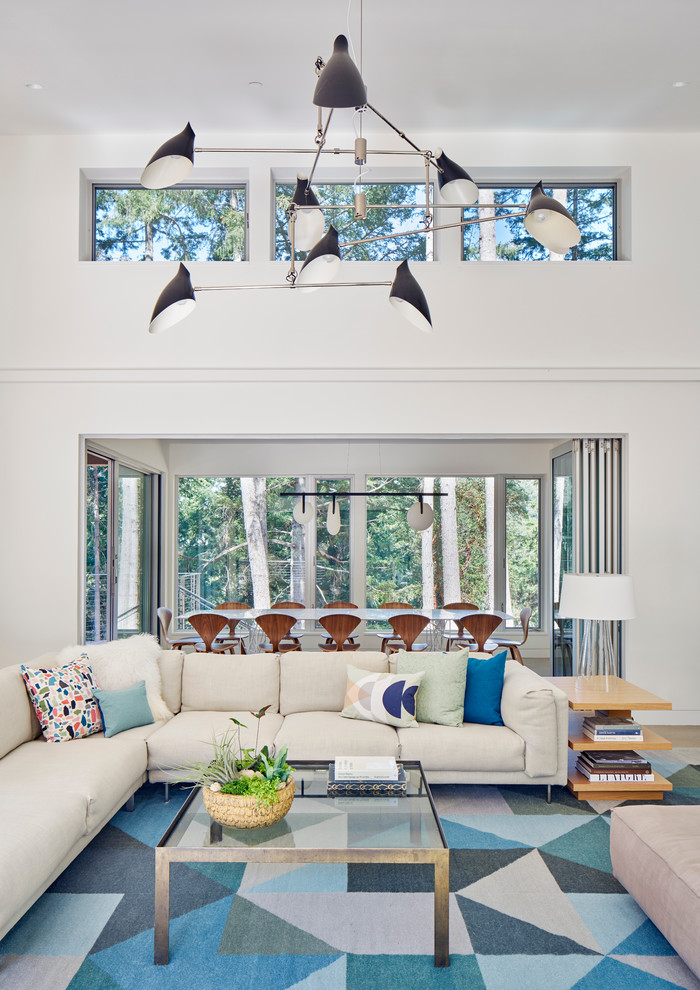 Mid-sized contemporary open concept family room in San Francisco with white walls.