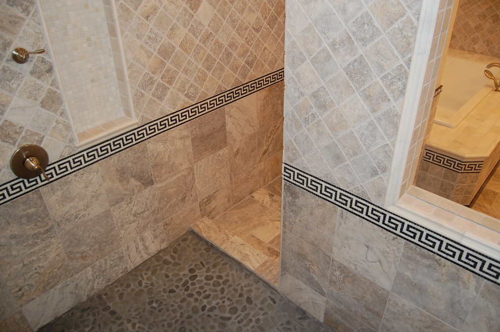 Example of a large transitional master multicolored tile and stone tile marble floor drop-in bathtub design in Chicago with flat-panel cabinets, dark wood cabinets, marble countertops, a two-piece toilet, an undermount sink and beige walls