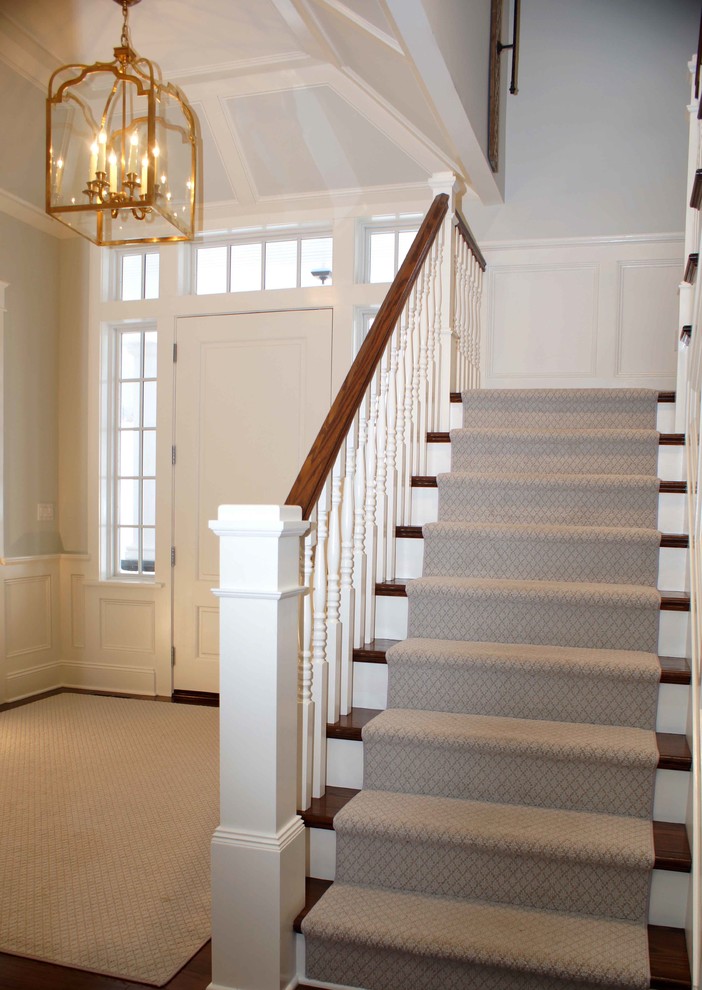 Inspiration for a mid-sized transitional dark wood floor foyer remodel with blue walls and a white front door