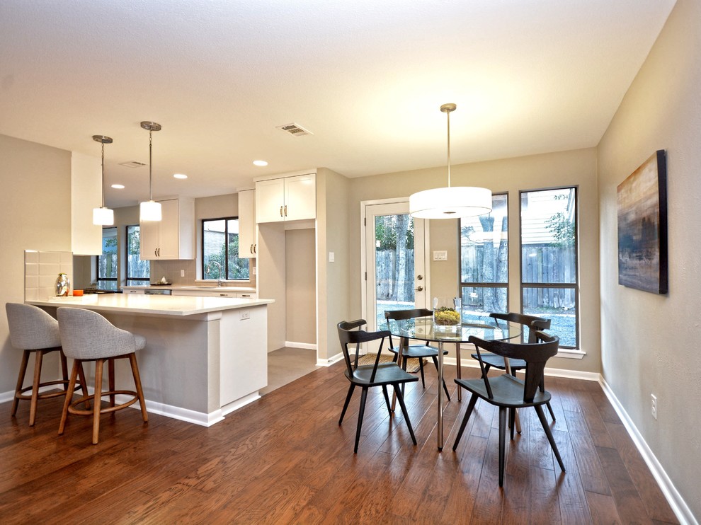 Kitchen/dining room combo - small transitional medium tone wood floor kitchen/dining room combo idea in Austin with gray walls