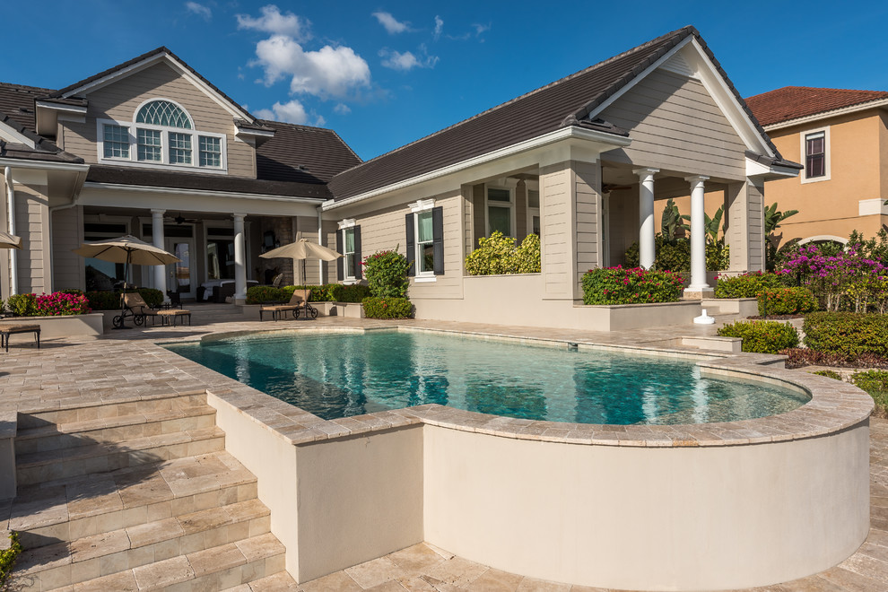 Inspiration for a mid-sized modern backyard custom-shaped aboveground pool in Orlando with tile.