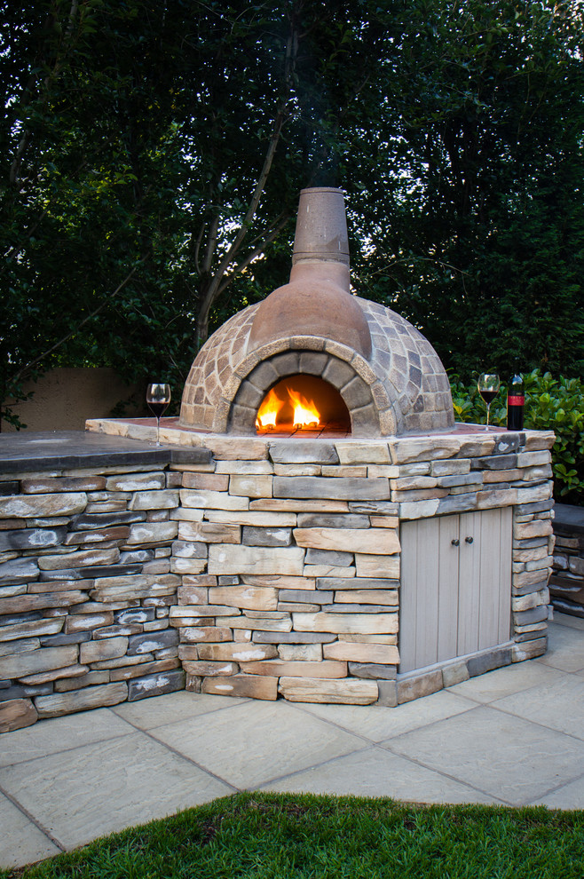 Inspiration for a rustic full sun backyard concrete paver landscaping.