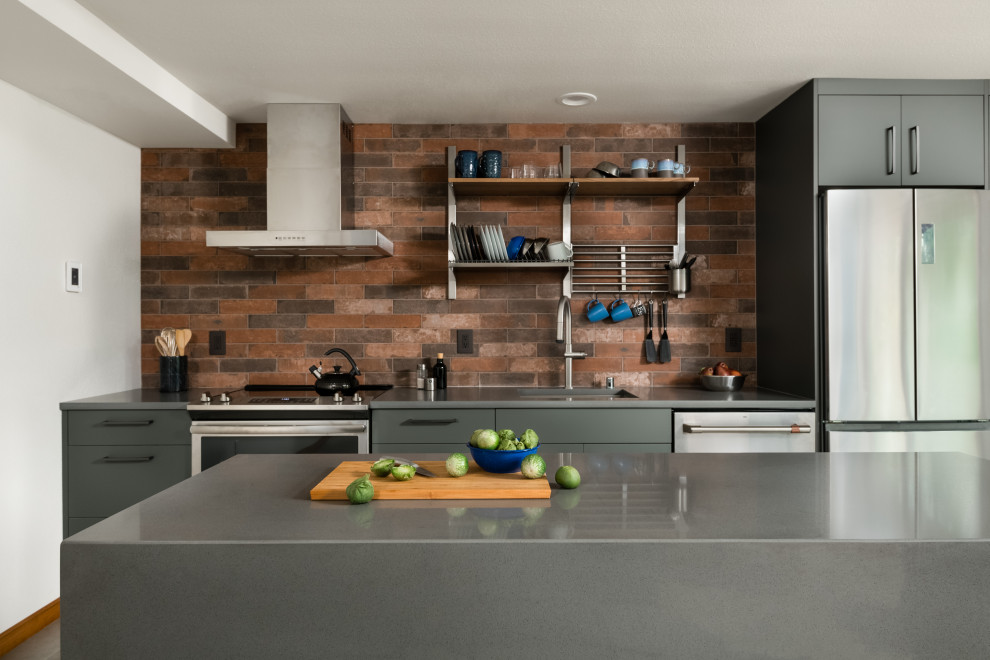Inspiration for a small single-wall open plan kitchen in Seattle with an undermount sink, flat-panel cabinets, grey cabinets, quartz benchtops, brown splashback, porcelain splashback, stainless steel appliances, porcelain floors, with island, grey floor and grey benchtop.