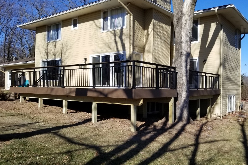 Inspiration for a large backyard deck remodel with no cover