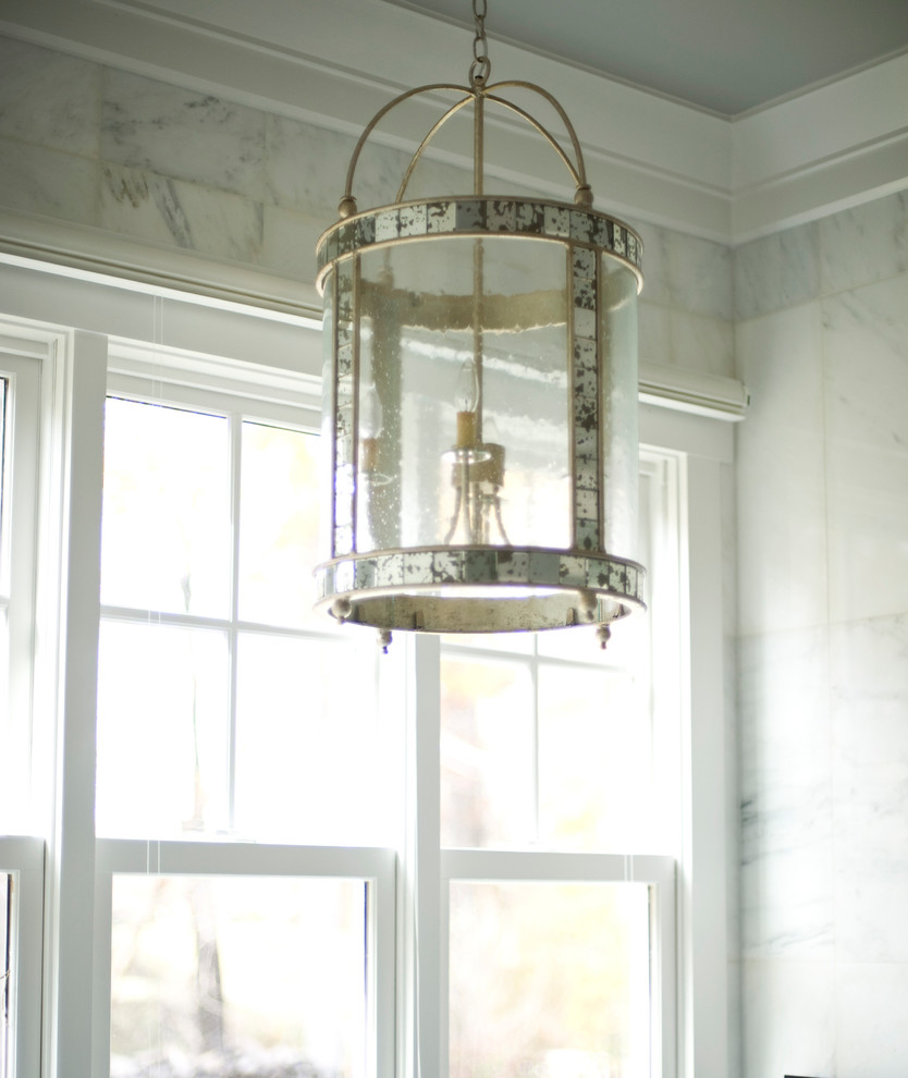 Inspiration for a large transitional master gray tile gray floor drop-in bathtub remodel with shaker cabinets, dark wood cabinets, gray walls, an undermount sink and a hinged shower door