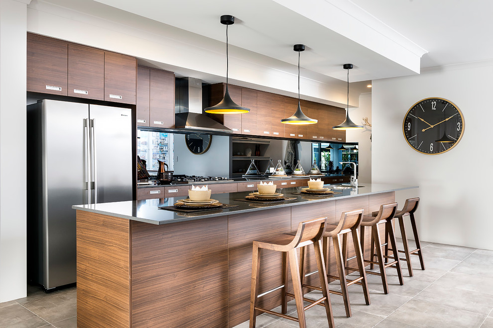 Inspiration for a mid-sized contemporary galley eat-in kitchen in Perth with dark wood cabinets, metallic splashback, mirror splashback, stainless steel appliances and with island.