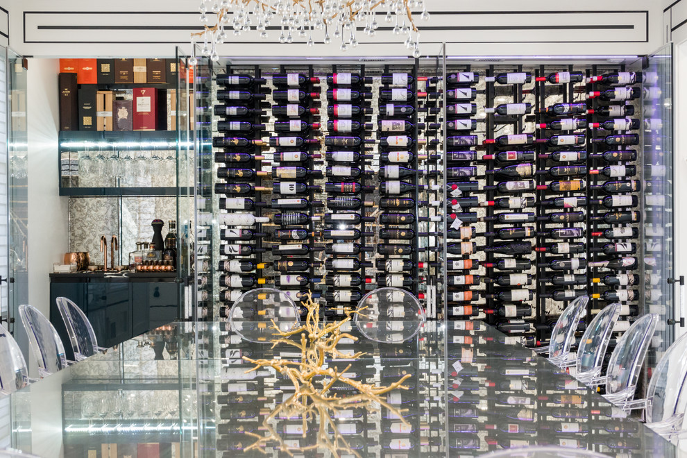 Inspiration for a mid-sized modern wine cellar in New York with marble floors, display racks and white floor.