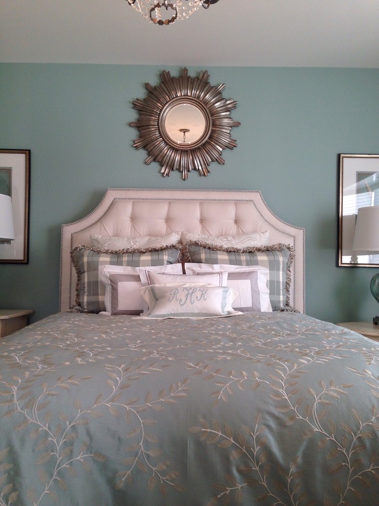 Transitional master bedroom in Detroit with blue walls.