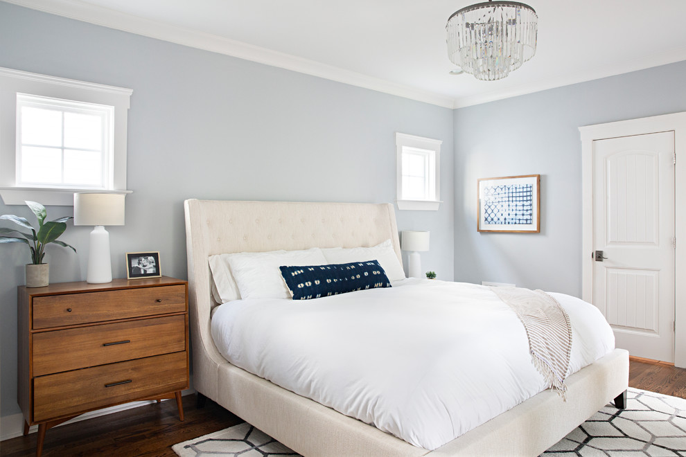Inspiration for a transitional master bedroom in Nashville with blue walls, dark hardwood floors and brown floor.