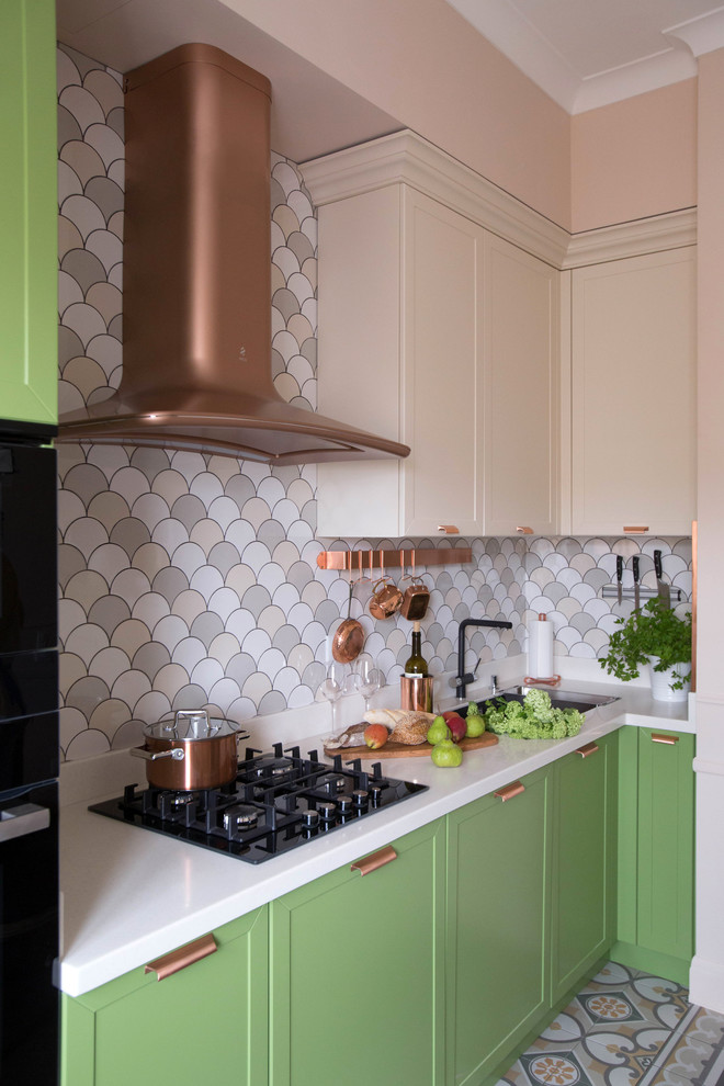 Mid-sized transitional l-shaped kitchen in Moscow with green cabinets, multi-coloured splashback, ceramic splashback, ceramic floors, no island, multi-coloured floor, white benchtop, a single-bowl sink and shaker cabinets.